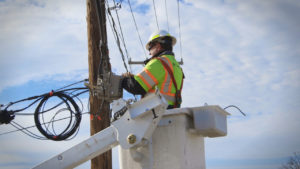 Electrical worker on electrical pole for Charter
